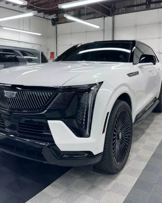 White Cadillac Escalade with tinted windows at Mario's Tint Shop