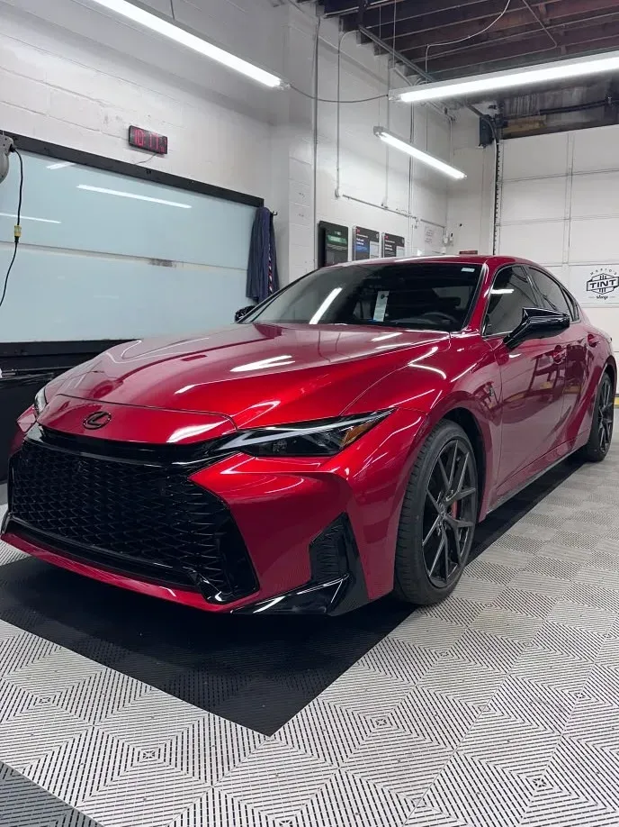 Red Lexus IS with freshly installed window tint at Mario's Tint Shop
