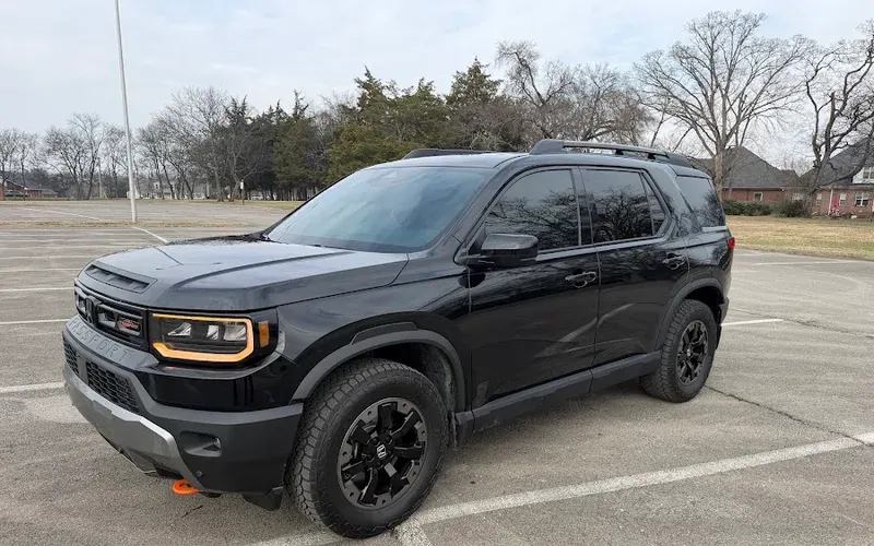 Christopher's black Honda Passport with fresh window tint