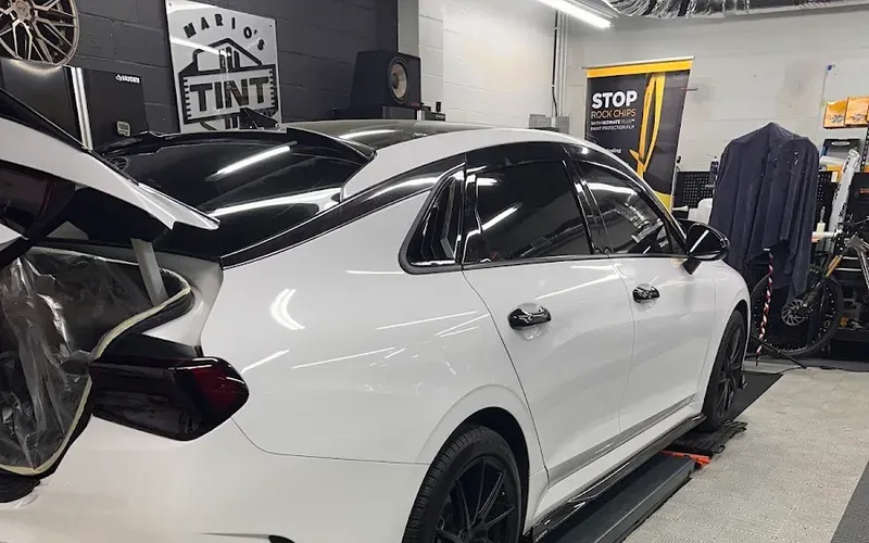 Damone's white sedan tinted in Mario's Tint Shop