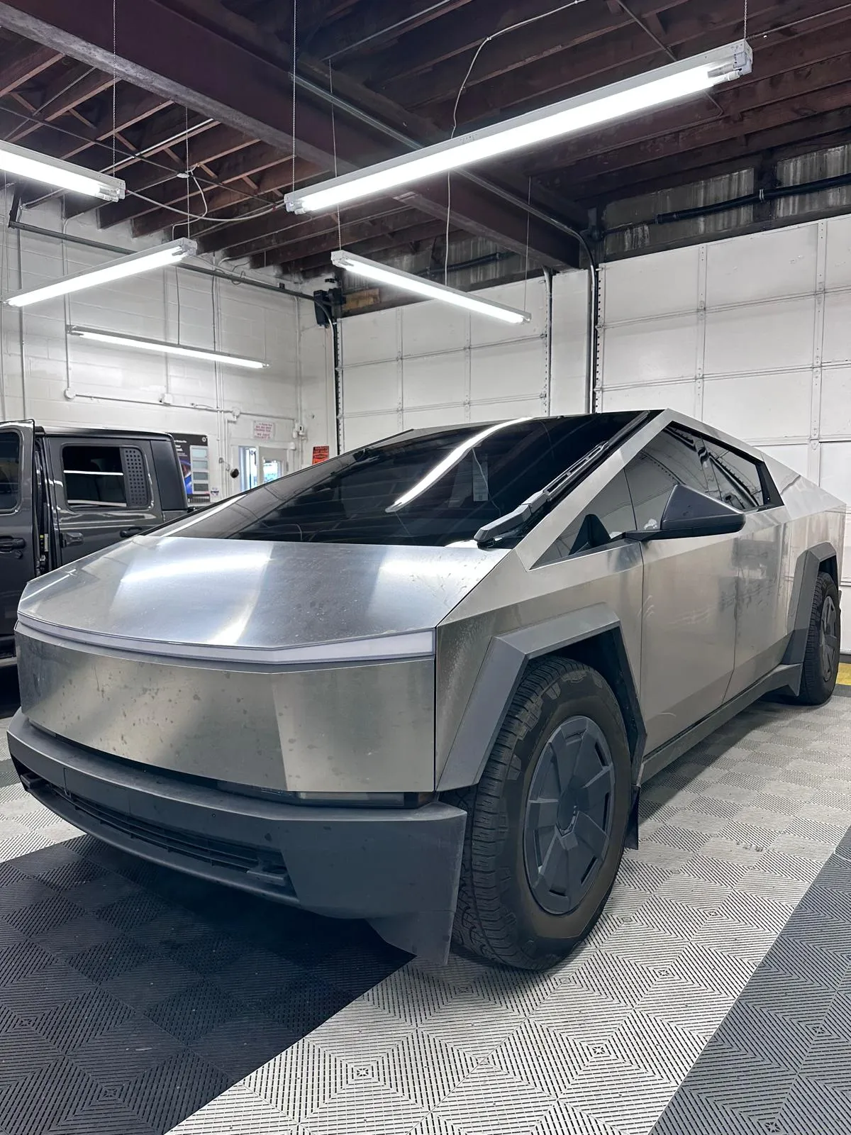 Tesla Cybertruck in the bay at Mario's Tint Shop